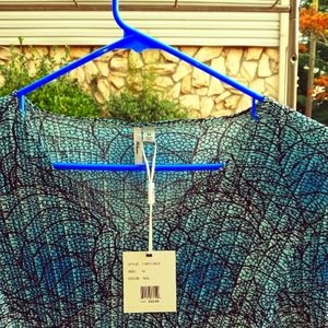 Teal blouse made by Milano size medium. 100% polyester.